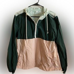 Lightweight hooded wind breaker. Small stain on collar, will come out if treated